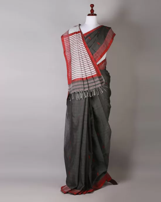 Small house and tree pattern pure silk saree is grey and red color.